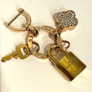 Gold authentic Louis Vuitton Key and Lock Charm Keychain.  Key chain unbranded